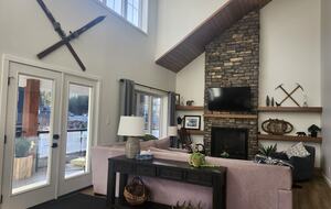 Main level living room. Doors to large balcony.