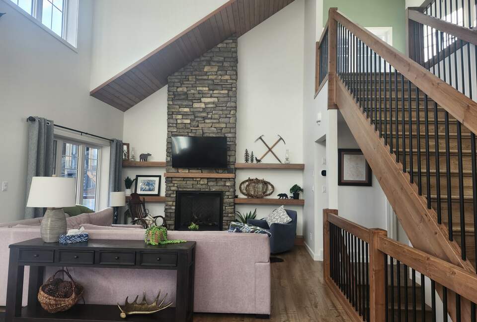 Main floor living room. Stairs to upper bedrooms.