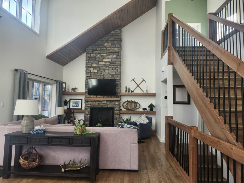 Main floor living room. Stairs to upper bedrooms.