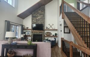 Main floor living room. Stairs to upper bedrooms.