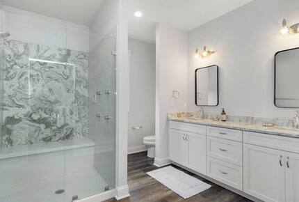 Master bath with large walk-in shower and closet