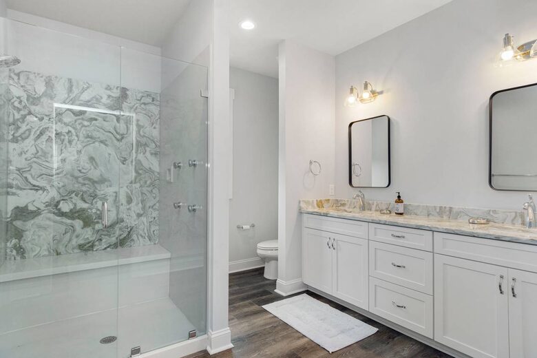 Master bath with large walk-in shower and closet