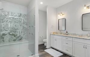 Master bath with large walk-in shower and closet