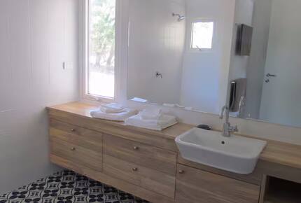 Indoor bathroom with shower- toilet is separate