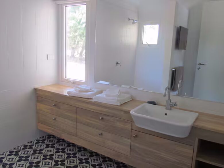 Indoor bathroom with shower- toilet is separate