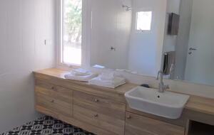 Indoor bathroom with shower- toilet is separate