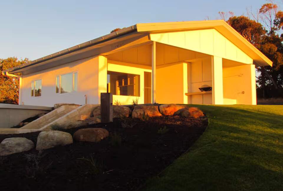 River blue straw bale solar passive eco cottage