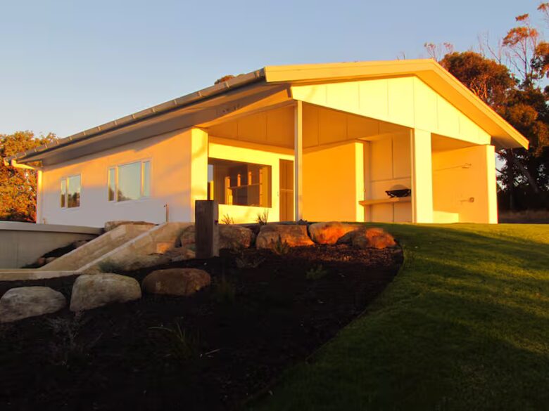 River blue straw bale solar passive eco cottage