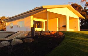 River blue straw bale solar passive eco cottage