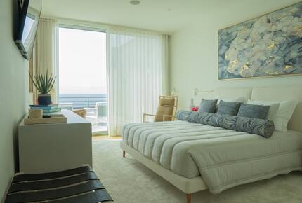 Primary Bedroom with Ocean Front Deck and En Suite Bath