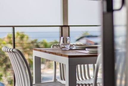 Balcony dining with open air and sunlight