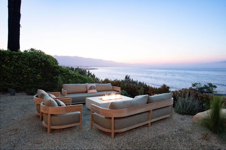 lounge area with fire pit at dusk
