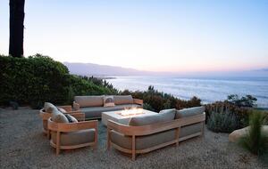 lounge area with fire pit at dusk