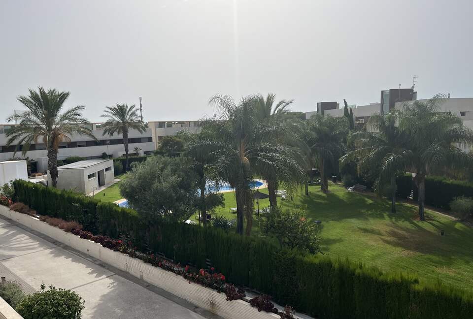 Contemporary Apartment Framed by Lush Gardens - El Puerto de Santa María, Spain