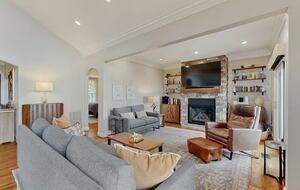 Den with radiant heat fireplace