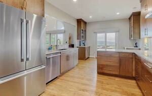 Kitchen boasts good views to outdoors or greatroom (TV)