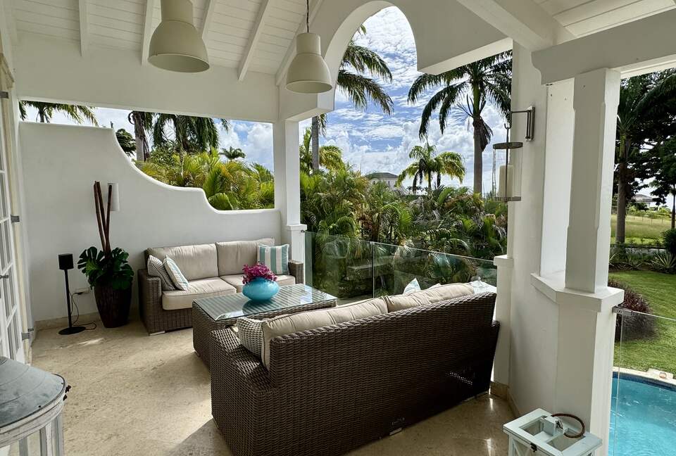 Outdoor living area with sunset views over the Caribbean Sea