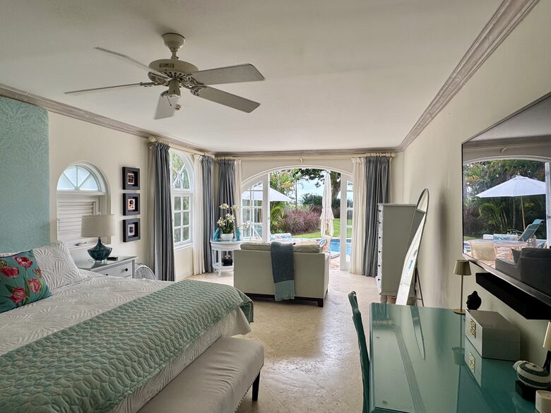 Main bedroom with living area and pool access