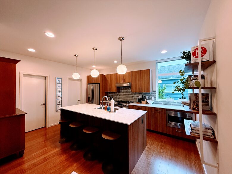 Modern kitchen amenities and half bath