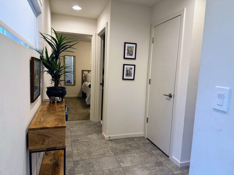 Ground floor entry; features two bedrooms with shared bathroom