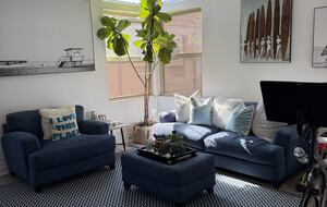 Second Floor Living Area with TV and Fireplace